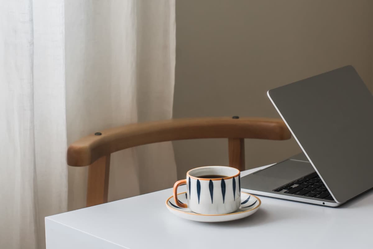 Laptop and coffee at Autumn Pines in Humble, Texas