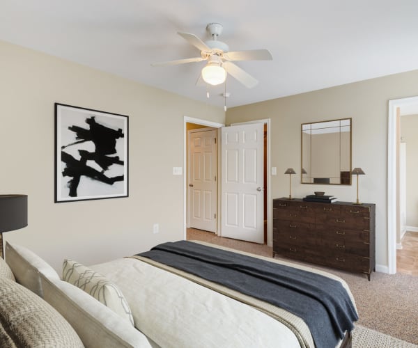 A furnished bedroom in a home at The Village at Midway Manor in Virginia Beach, Virginia