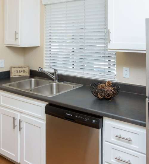 Dishwasher in apartment kitchen at Amber Court in Fremont, California,