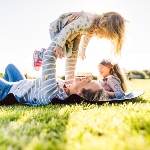 A resident family relaxing in a local park near Perry Circle Apartments in Annapolis, Maryland