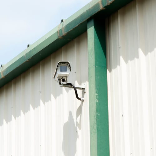 Security camera mounted on an exterior wall at Red Dot Storage in Woodstock, Illinois