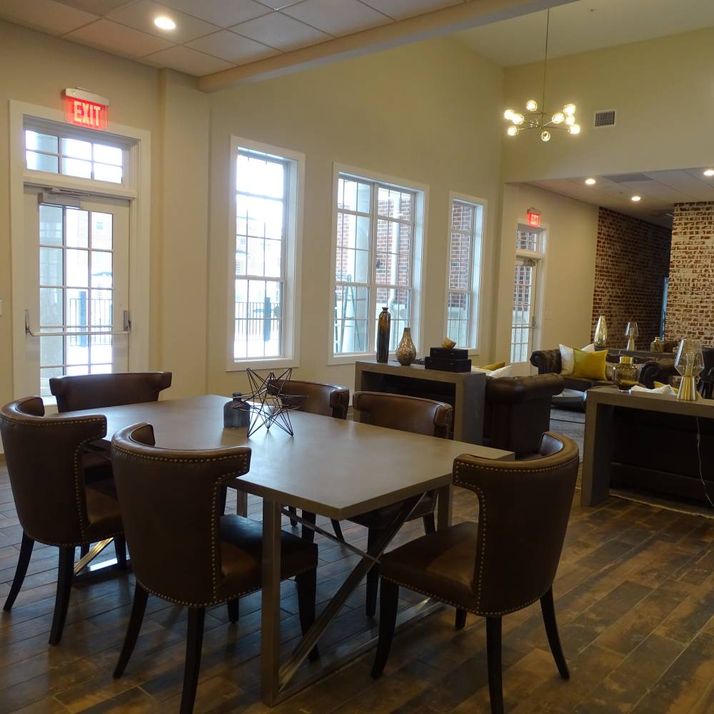 Community hall with seating and social space at Meadow Branch Apartments in Winchester, Virginia
