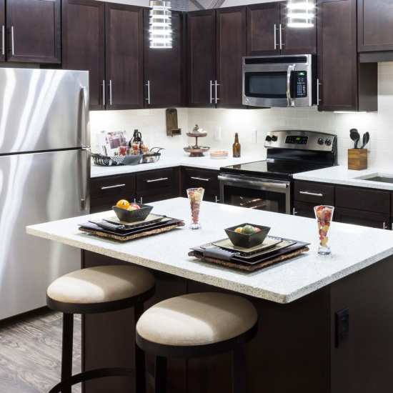Kitchen with stainless-steel appliances at Pike West Commerce in Dallas, Texas
