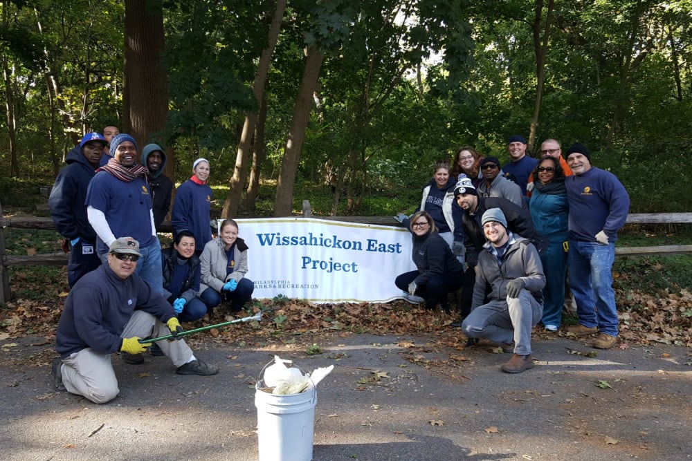 Employees at Eagle Rock Properties in Plainview, New York participating in a park cleanup.