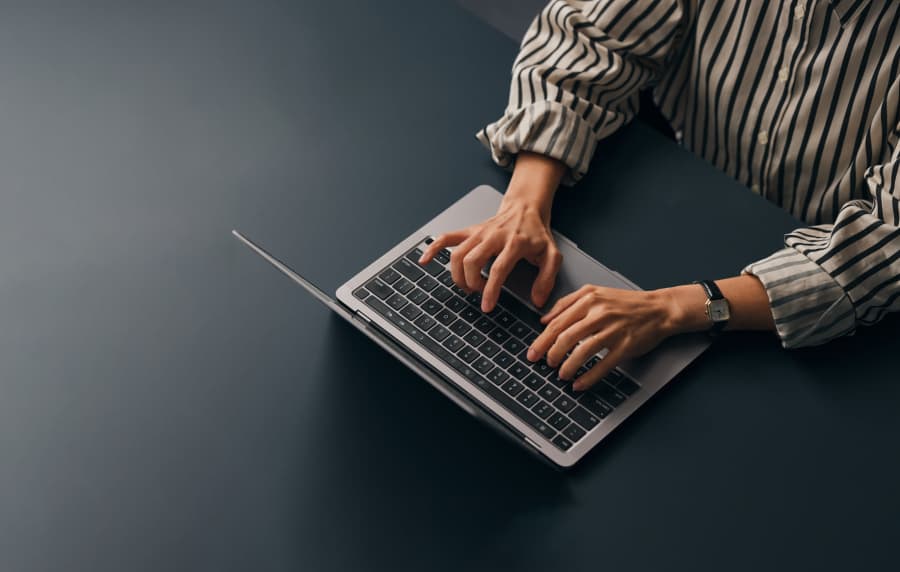 Resident working on a laptop at Meribel in Weaverville, 
