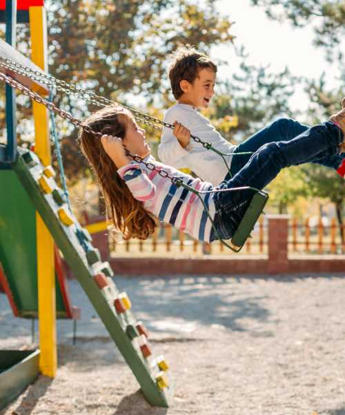 Kids playing on swing at Emerald Place in Lancaster, Ohio