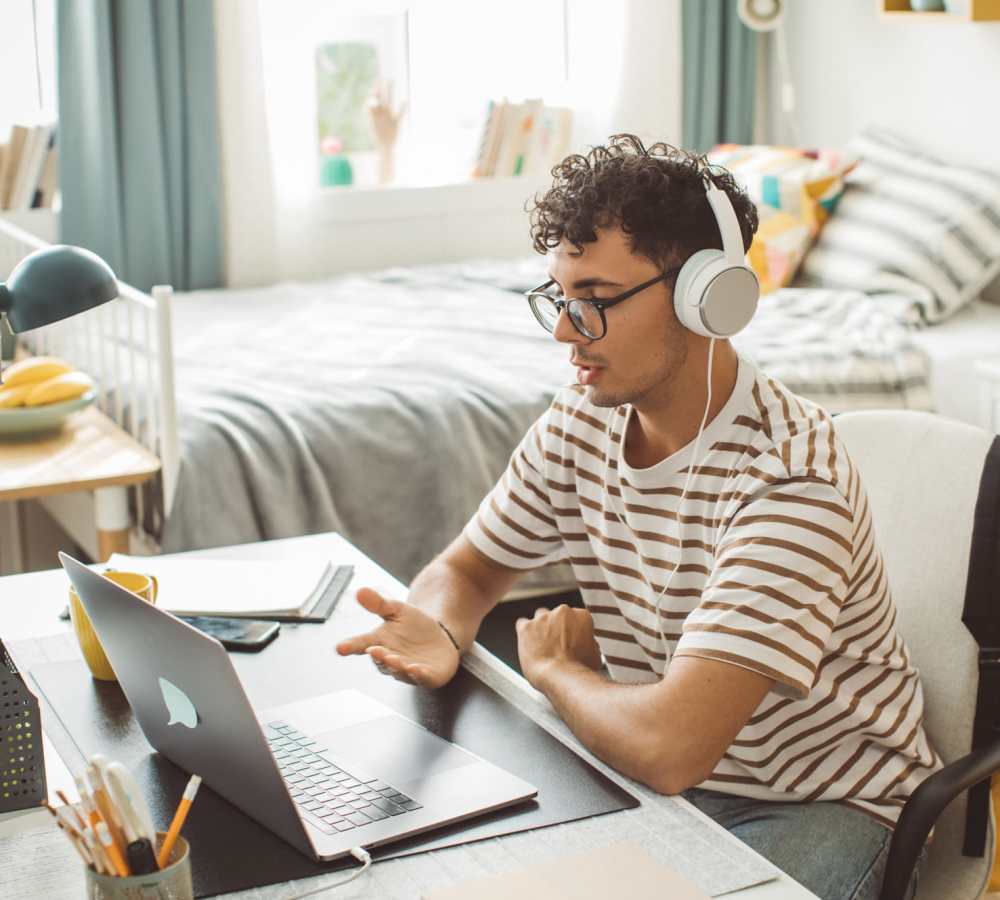 Student resident studying on his laptop at Titan Court in Eugene, Oregon