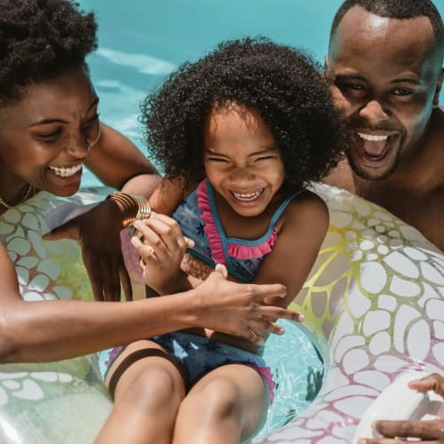 a family swimming together at Coral Sea Cove in Port Hueneme, California