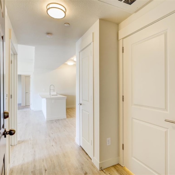 view into apartment from front doorway highlighting entry closets at The Palms at Morada in Stockton, California