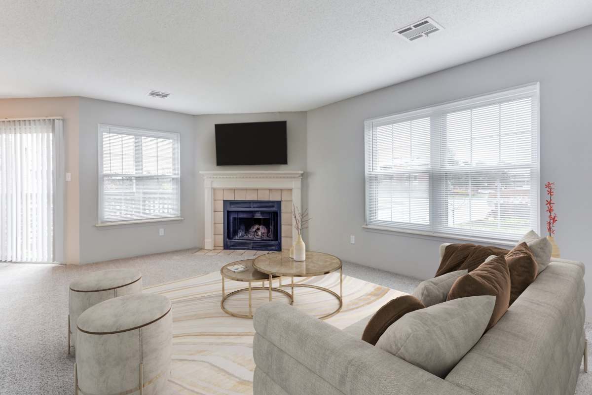 Living room opening onto a private patio at The Lakes of Schaumburg Apartment Homes in Schaumburg, Illinois