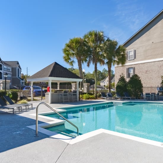 The sparkling swimming pool and grill at Astoria in Mobile, Alabama