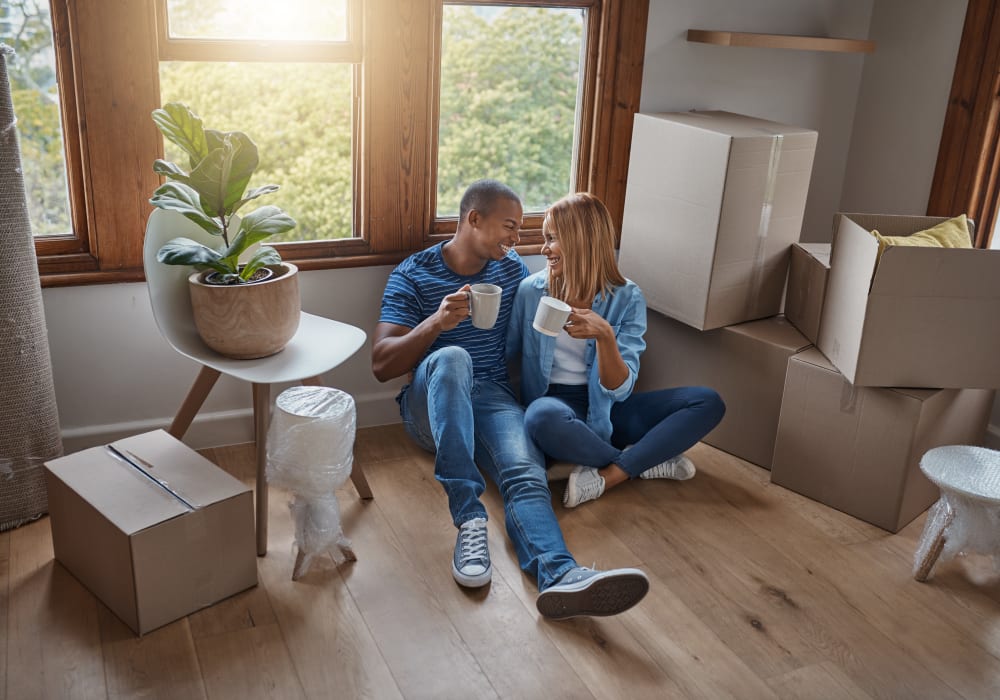 A couple sitting together drinking coffee near Handy Storage in Clearwater, Florida