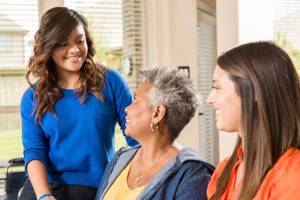 Family members visit resident at The Atrium in Rockford, Illinois