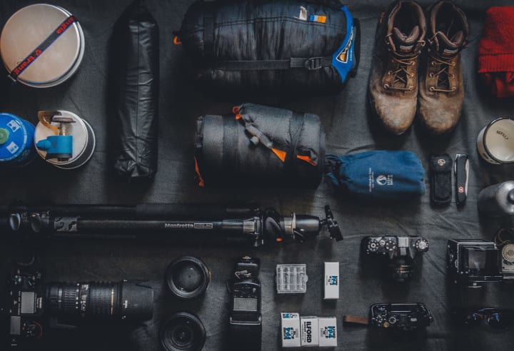 various camping gear laid out for inventory or cleaning