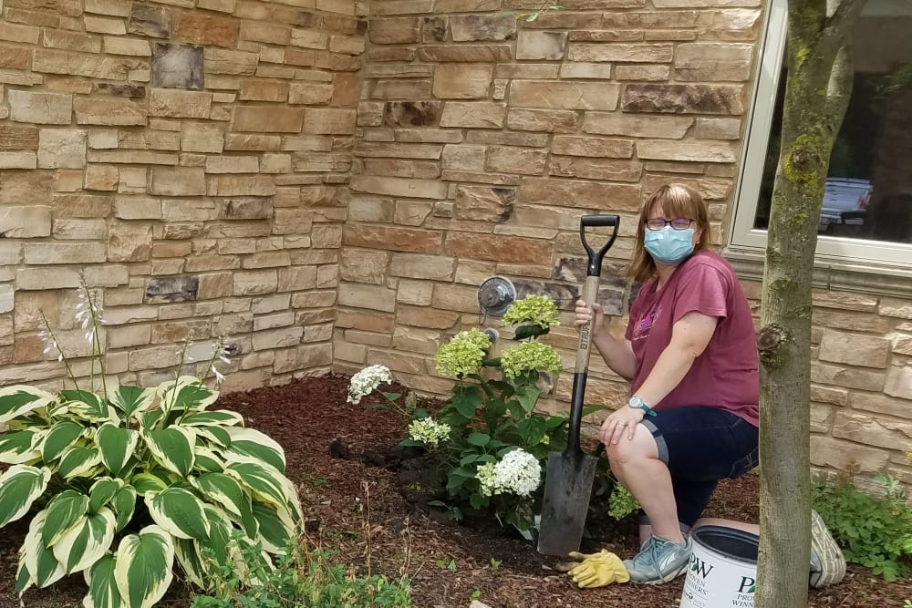 Staff assisting with resident gardening activity at Prairie Hills Cedar Rapids in Cedar Rapids, Iowa.