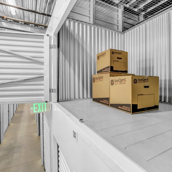 Branded boxes in an open storage locker at StorQuest Self Storage in Denver, Colorado