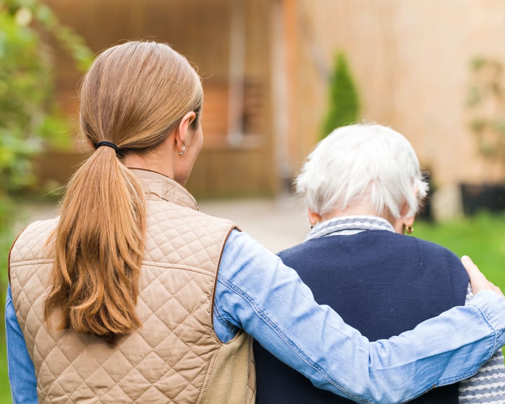 A family member taking a respite care resident into Clover Ridge Place in Maquoketa, Iowa.