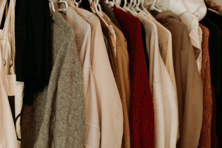 hanging sweaters and cardigans