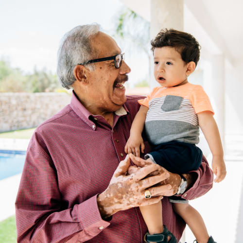 Resident with his grandson at Innovation Senior Living in Winter Park, Florida