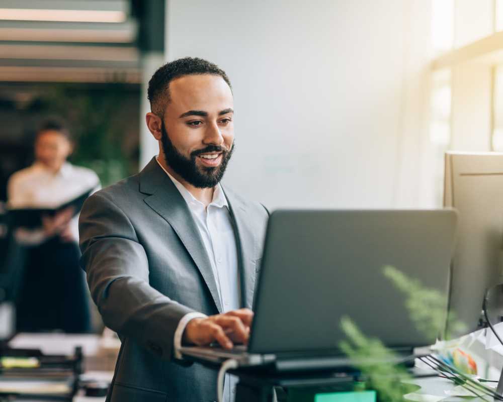 Team member looking at his computer at Stintino Management in Charlotte, North Carolina