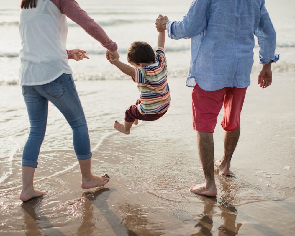Residents walking on the beach with their child near Eucalyptus Ridge in Lakeside, California
