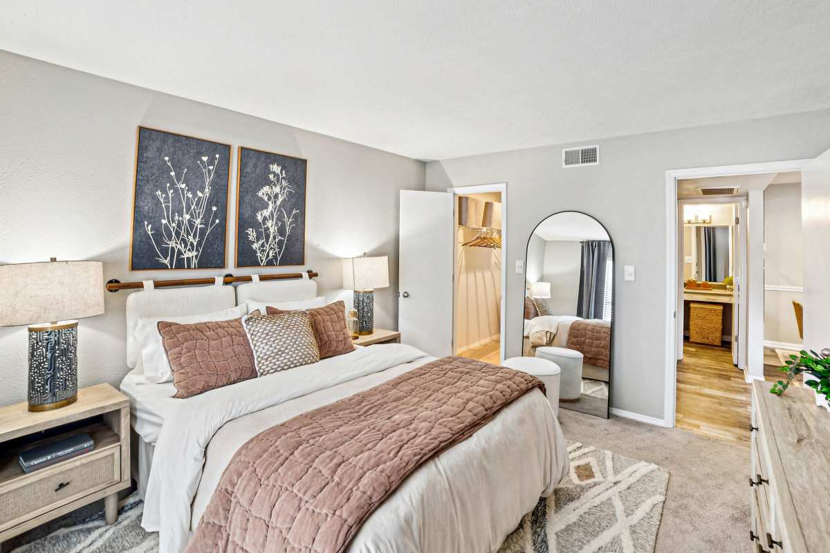 Master bedroom with plush carpeting at Lakes at Lincoln in Greensboro, North Carolina