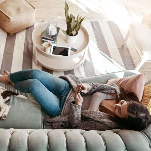 A resident relaxes in her apartment at The Encore, Alexandria, Virginia