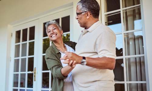 Resident couple dancing outside on the porch at Ashley Park in Charleston, South Carolina