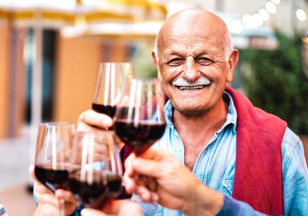 Resident drinking wine at Lakeview Senior Living in Lakewood, Colorado