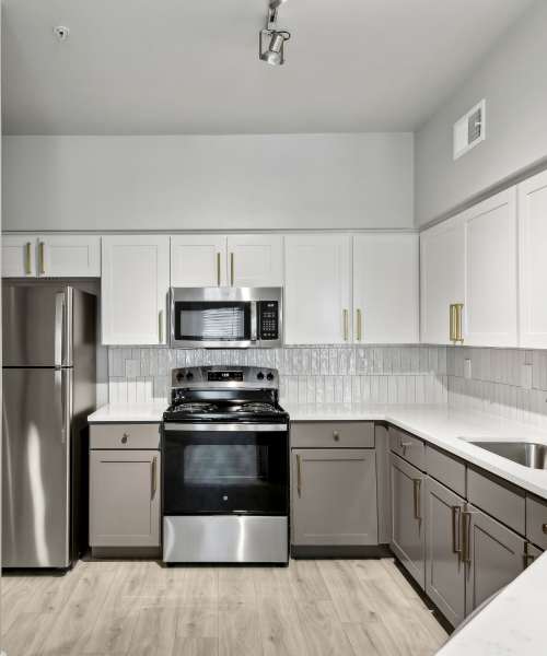Kitchen with wooden flooring at Collier in Pflugerville, Texas