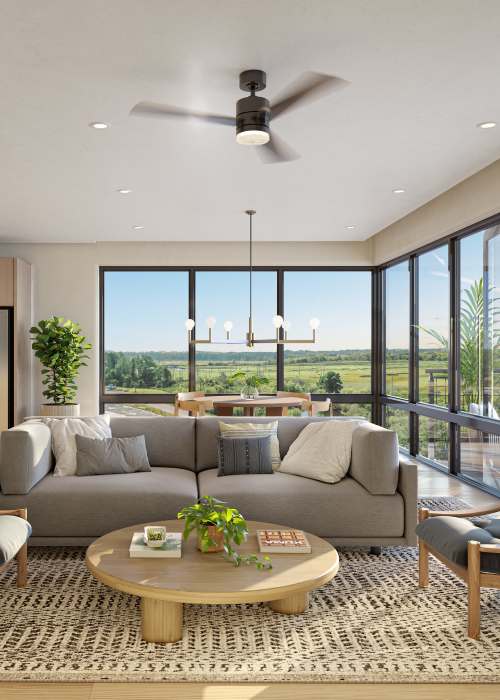 Spacious living room with large windows at Proximity Watermark in Wilmington, North Carolina