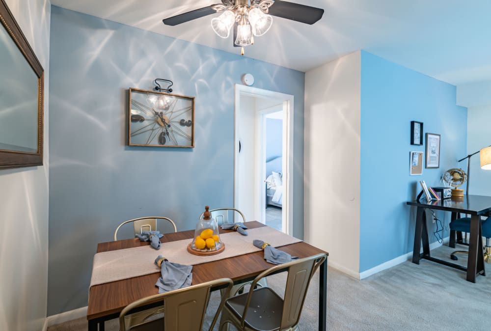 Dining area with a ceiling fan at Country Village Apartment Homes in Dover, Delaware