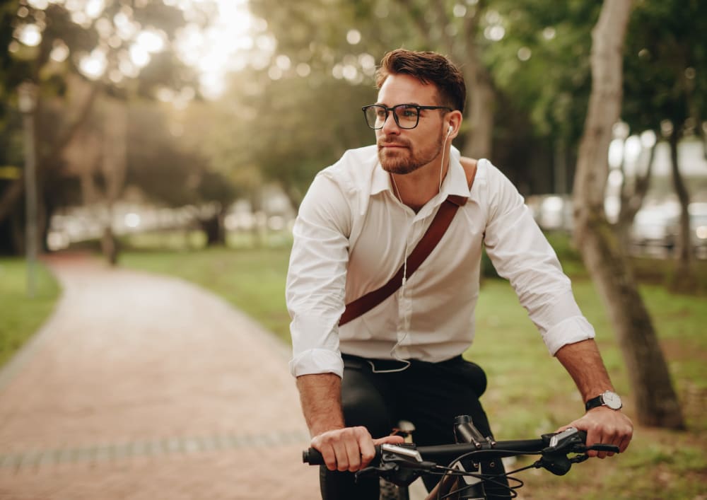 Resident biking on a path near Montebello at Summit Ridge in Reno, Nevada