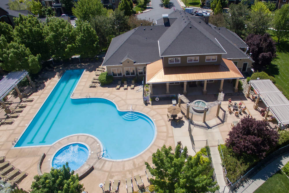 Aerial view of swimming pool, hot tub, and sundeck at The Vintage at South Meadows Condominium Rentals in Reno, Nevada