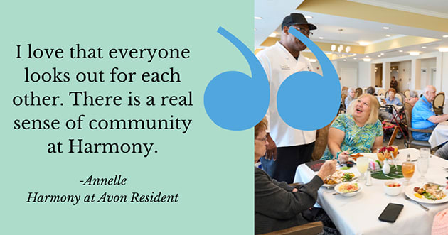 Harmony at Avon residents laughing and enjoying a meal together