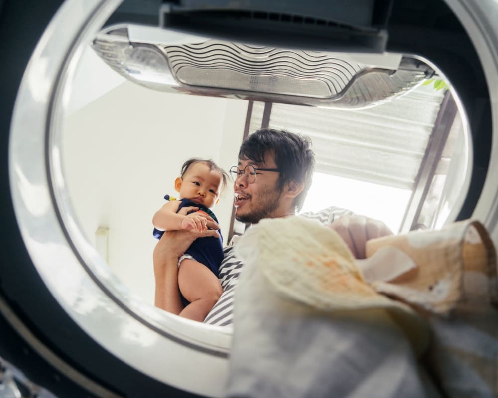 Rendering resident doing laundry at Bayshore Apartments in East Haven, Connecticut