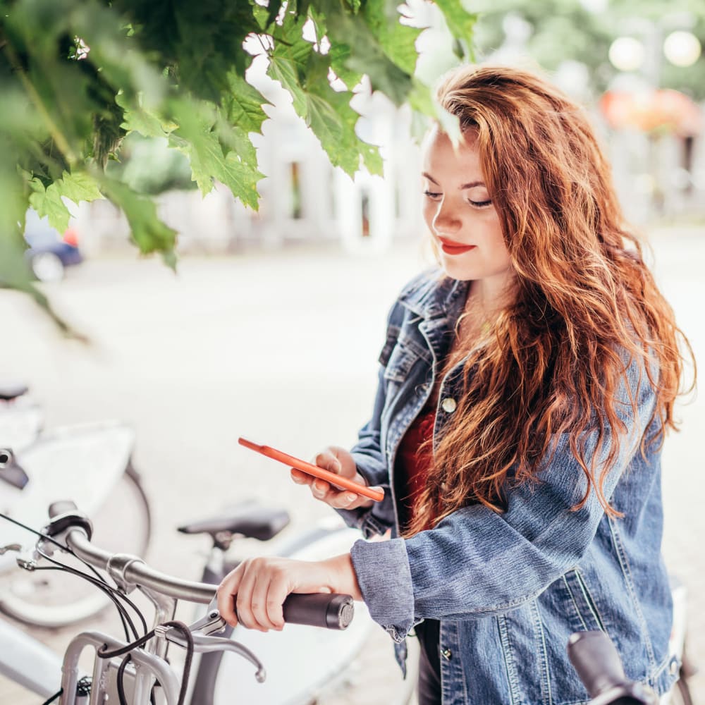 Resident parking her bike near Riverside Towers Apartment Homes in New Brunswick, New Jersey