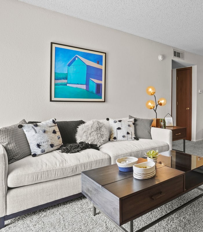 Spacious carpeted living room at Aspen Park Apartments in Wichita, Kansas