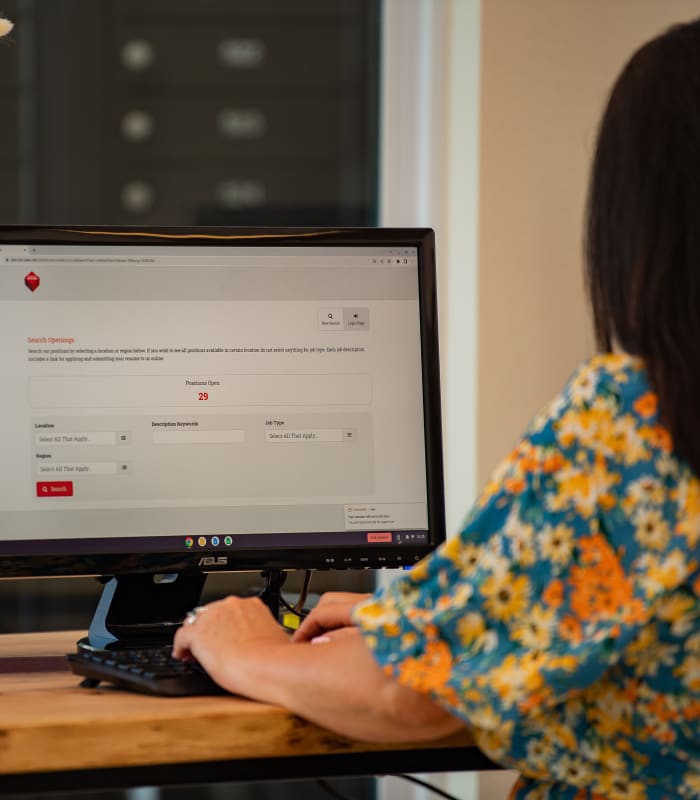 Employee on a computer at Case & Associates