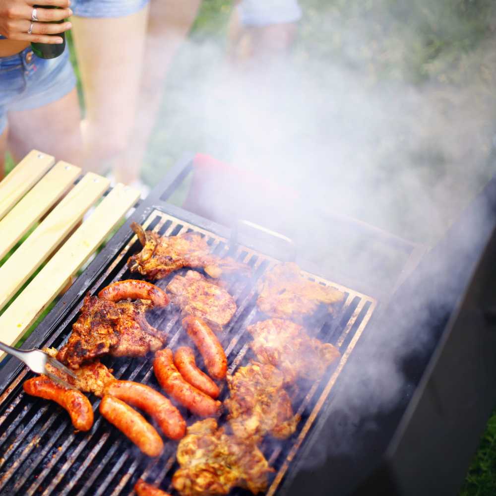 Residents using barbeque grills at Monarch West in Houston,Texas