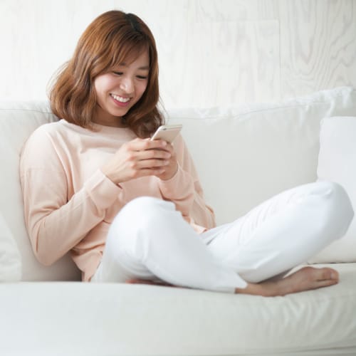 A resident on her phone at Wire Mountain III in Oceanside, California