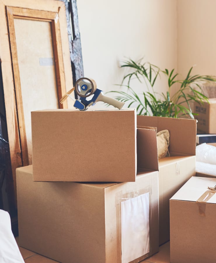 A stack of boxes and some packing tape at a home near 101 Storage in Valley Village, California