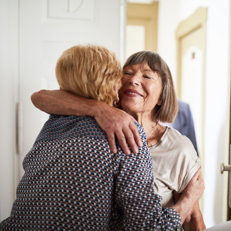 Two residents hugging at Avion Point Seniors in Charlotte, North Carolina