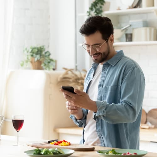 Man checks his phone before lunch at Radiate in Redmond, Washington