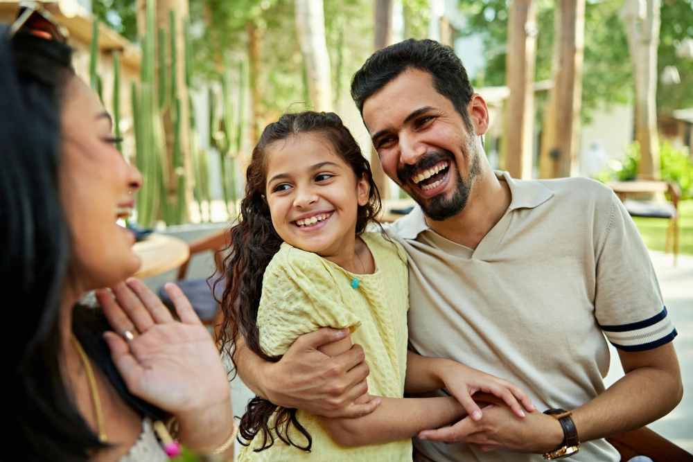 Father and daughter outside their apartment at Promenade at Grande Park in Spring Hill, Florida