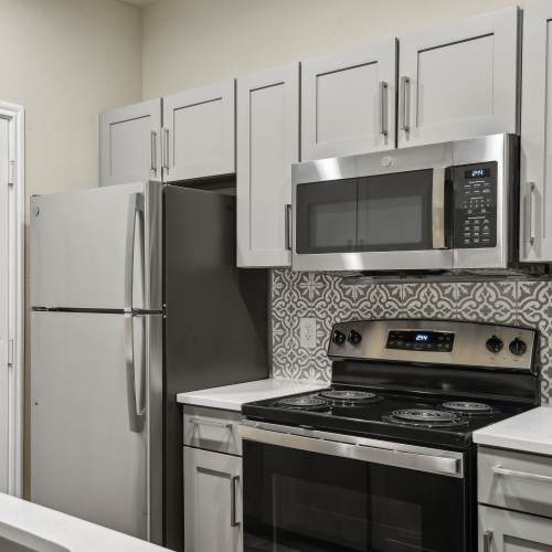 Apartment kitchen with stainless-steel appliances Charleston in San Antonio,Texas