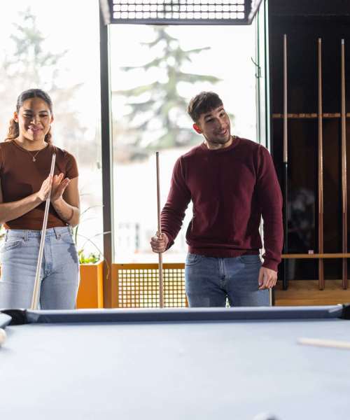 Resident friends playing in clubhouse at Emerald Place in Lancaster, Ohio