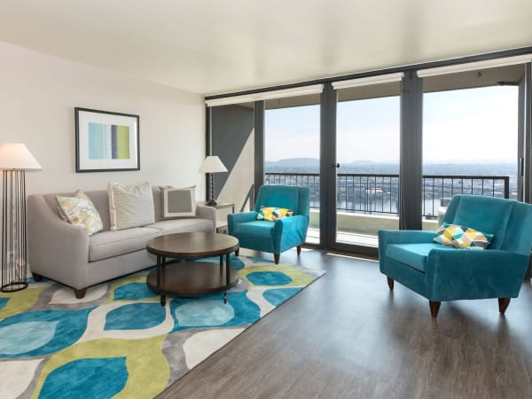 Modern decor in the open-concept living area of a model home at Harrison Tower in Portland, Oregon