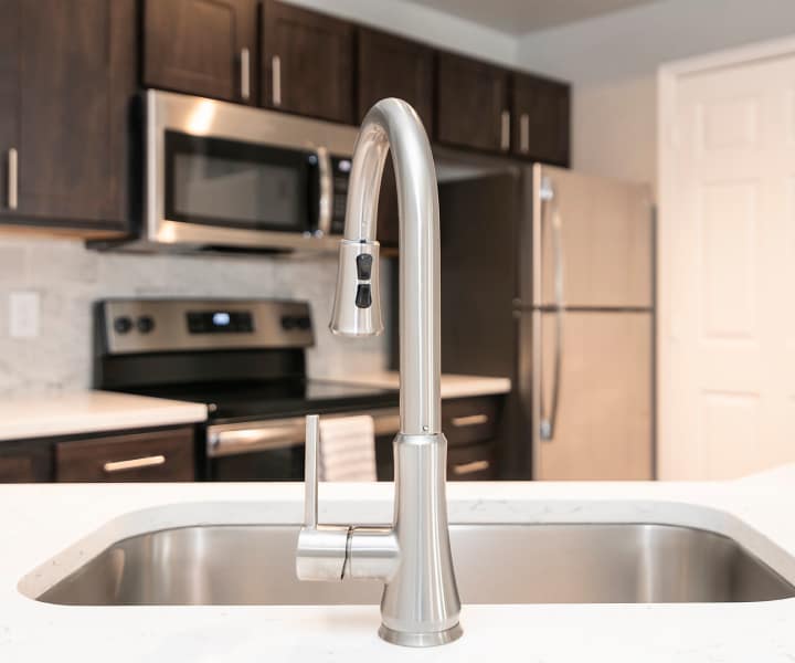 View of kitchen with water sink at Carrara At Cole in Dallas, Texas