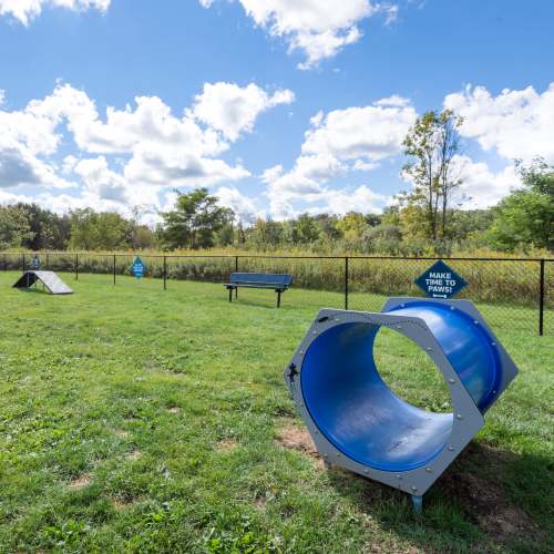 Fenced dog park at Auburn Creek Apartments in Victor, New York